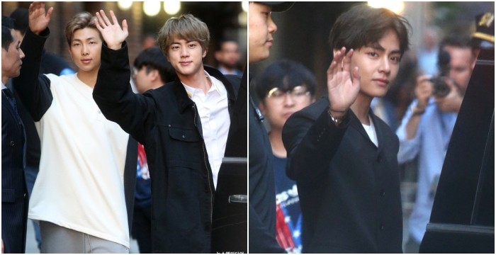 Superstars BTS  smiles and waves hands to paparazzi 